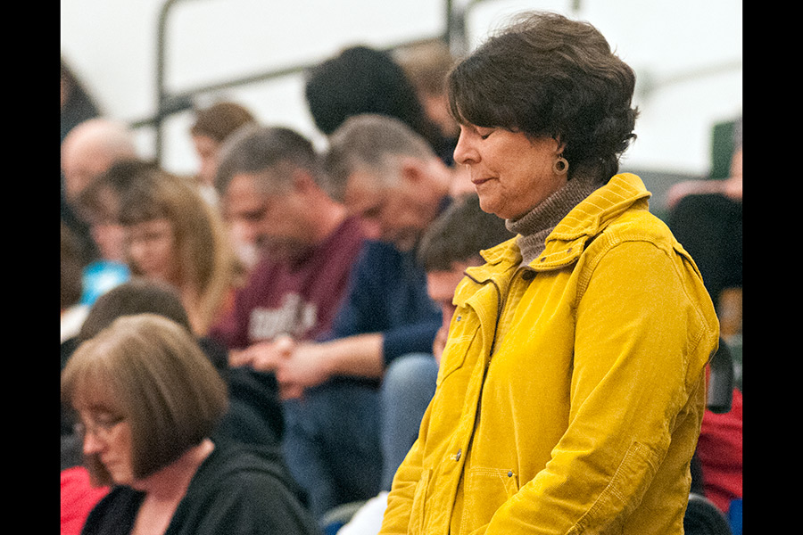 Anne Audet pauses during a moment of silence in observance of the Jan. 21, 1984 tragedy. Audet's brother-in-law, Jim Withrow, was head coach of the wrestling team and was killed when the bus carrying the Whitefish High School wrestling team crashed along U.S. Highway 2 on the southern edge of Glacier National Park. Greg Lindstrom | Flathead Beacon