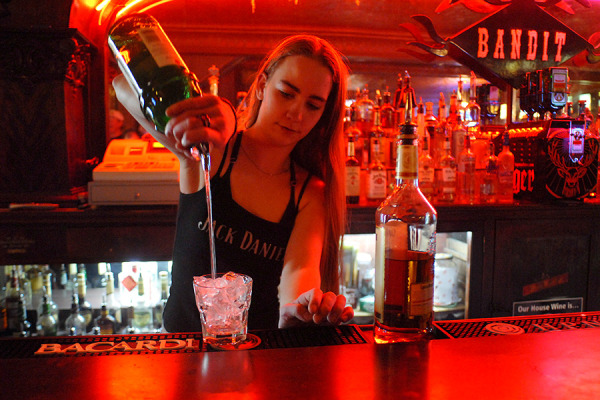 A bartender pours a drink at the Bandit in Columbia Falls. Beacon File Photo