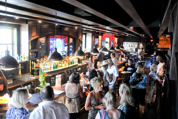 Patrons gather at the bar and restaurant area of Casey's Pub and Grill in downtown Whitefish.  Beacon File Photo