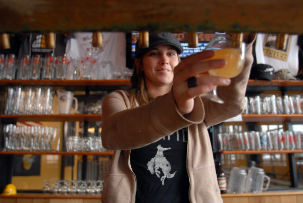 A server pours a beer at the Great Northern Brewing Company in Whitefish. Beacon File Photo
