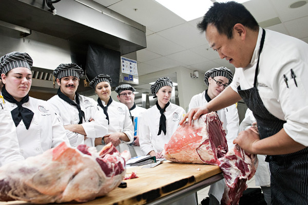 Chef Nai Kang Kuan teaches students at FVCC on how to properly prepare a lamb on Feb. 12, 2015. Kang worked for Iron Chef Morimoto for a number of years and today is the executive research chef for Hillshire Brands. Greg Lindstrom | Flathead Beacon