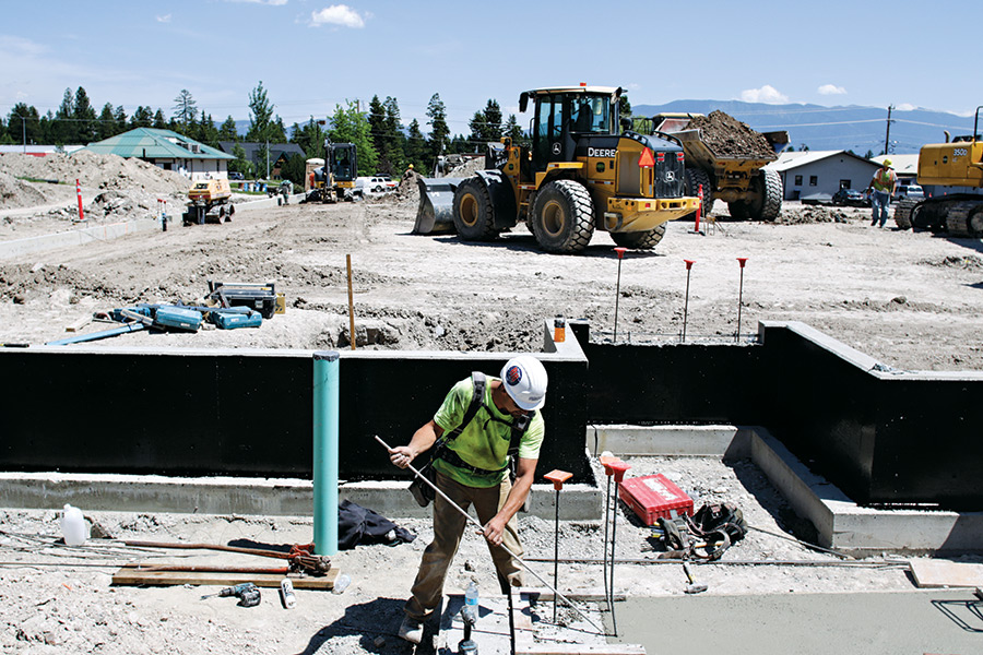 Crews work on the site of a future Hampton Inn & Suites on the south end of Whitefish. Greg Lindstrom | Flathead Beacon