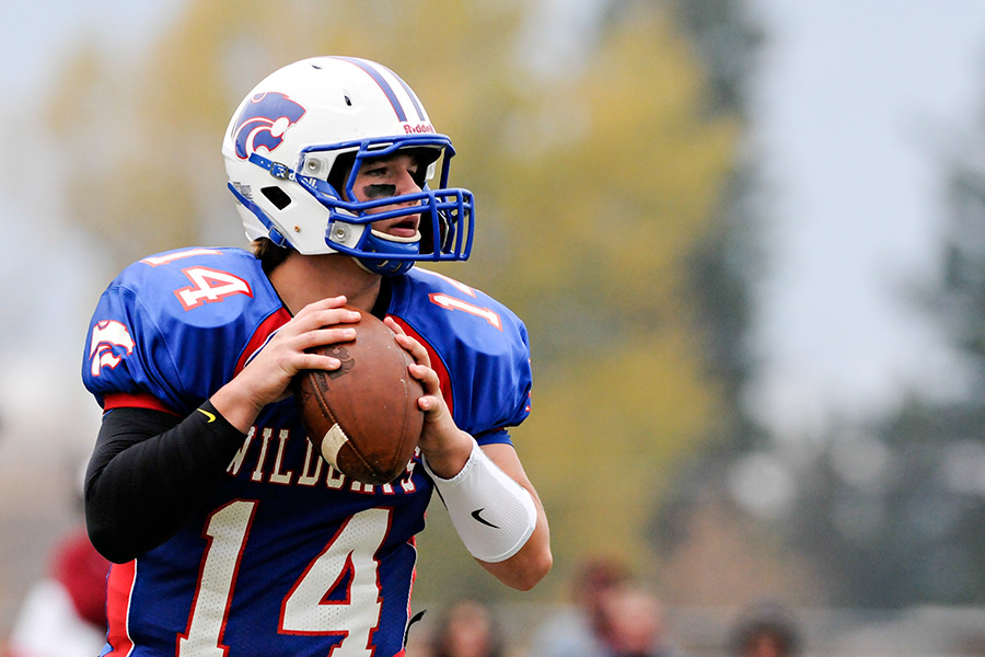 Columbia Falls quarterback Dakota Bridwell looks for an open receiver. Hamilton defeated Columbia Falls 27-21 in the first round of the Class A playoffs on Nov. 1, 2014. Greg Lindstrom | Flathead Beacon