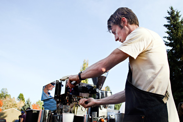 Matthew Bussard makes an expresso with milk from his cart on Oct. 6, 2015. Greg Lindstrom | Flathead Beacon