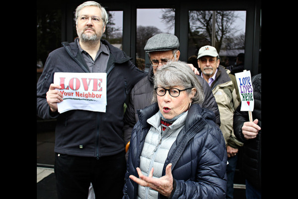 Ina Secher, center, and members of Love Lives Here speak to the media about the threats made by David Lenio outside the Flathead County Justice Center on Nov. 9, 2015. Greg Lindstrom | Flathead Beacon