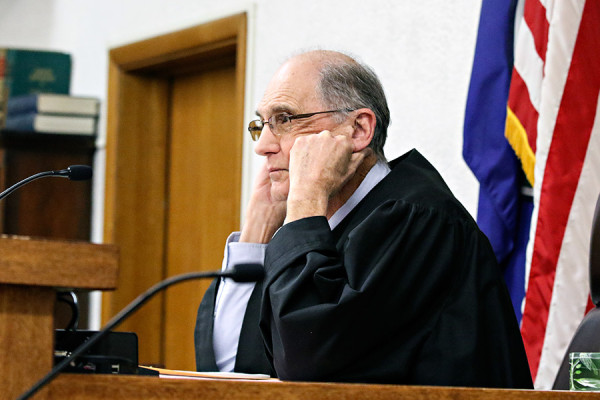 Sanders County District Judge James Wheelis listens to proceedings as Richard Raugust appears in Sanders County District Court in Thompson Falls on Dec. 4, 2015. Greg Lindstrom | Flathead Beacon
