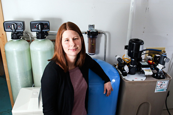 Lisa Miller shows her water system at her Kila home on Dec. 30, 2015. Greg Lindstrom | Flathead Beacon