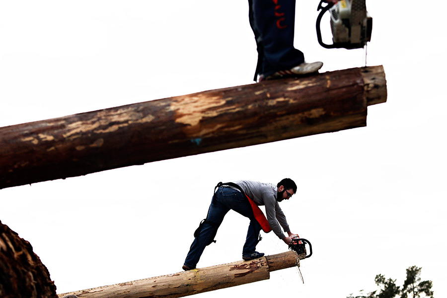 Christian Vestal, bottom, and Seth Probert practice the obstacle pole event during FVCC's Logger Sports team practice on March 30, 2016. Greg Lindstrom | Flathead Beacon