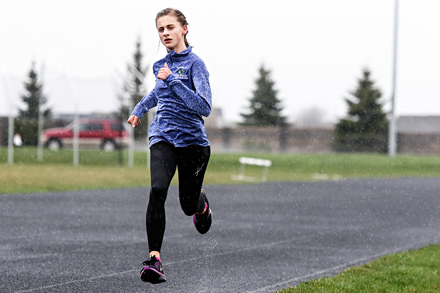 Annie Hill runs at Glacier High School on April 14, 2016. Greg Lindstrom | Flathead Beacon