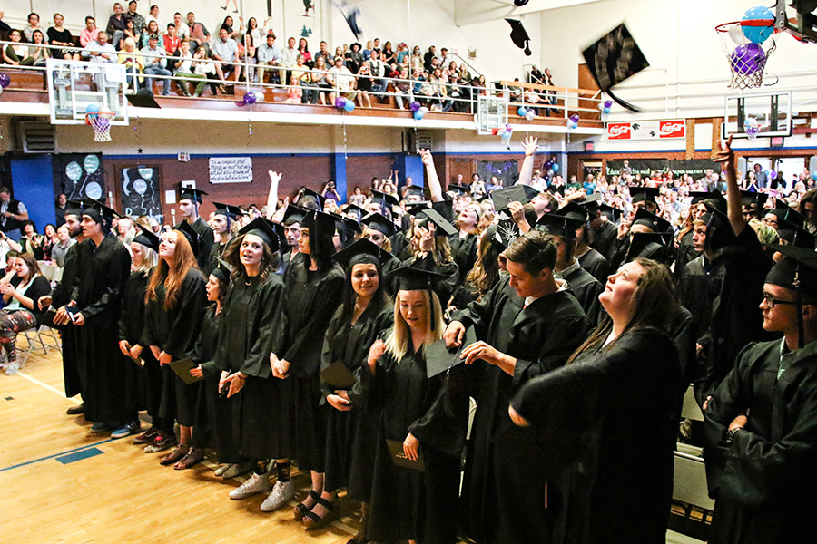 Students toss their caps in the air at Linderman Education Center's graduation on June 2, 2016. Greg Lindstrom | Flathead Beacon