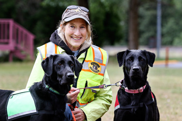 Deb Tirmenstein, with the Flathead Basin Commission, pictured with her dogs Rosebud, left, Ismay at an FWP watercraft inspection station in Ravalli on June 16, 2016. Greg Lindstrom | Flathead Beacon