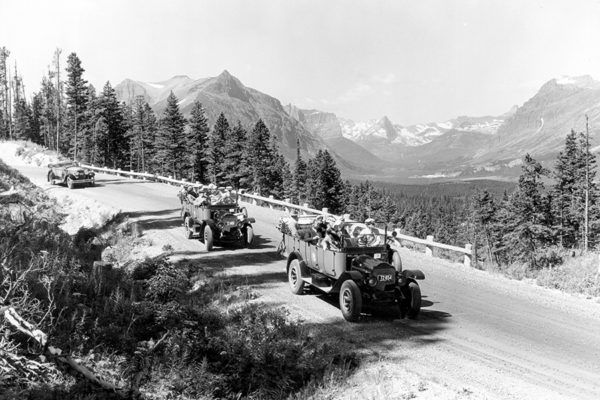 11845---3-Touring-Buses-on-Blackfeet-Hwy-with-St.-Mary-valley-in-background-(c.1932)