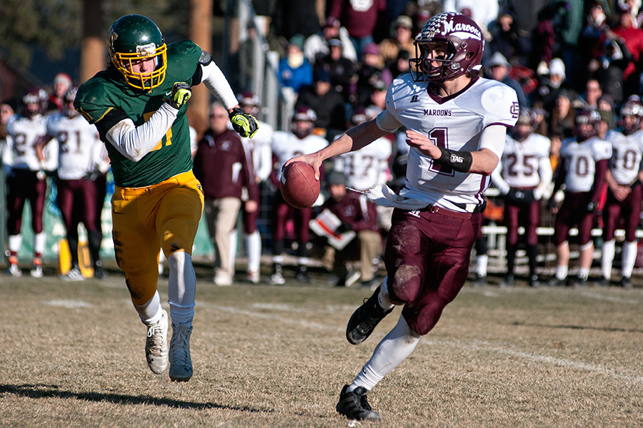 Travis Catina tries to run down Butte Central's Danny Peoples. Beacon File Photo