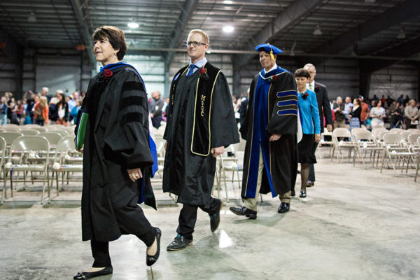Jane Karas, president of Flathead Valley Community College, and FVCC alumnus and Google X systems engineer Andrew Crawford lead the 47th commencement ceremony. Beacon File Photo