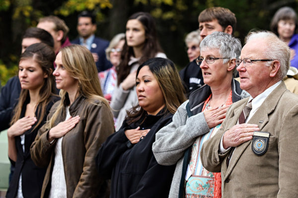 From left, Olga Bobko, Mandy Dawson, Bernadette Fuhst, Denise Mason and Daye-Llyn Randle recite the Pledge of Allegiance during a naturalization ceremony at the Apgar amphitheater in Glacier National Park on Sept. 21, 2016. Greg Lindstrom | Flathead Beacon