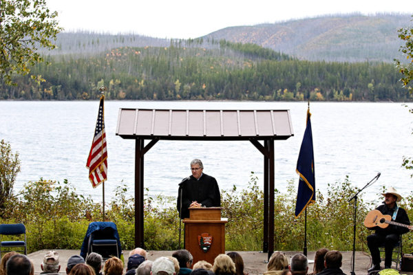 Dana Christensen, Chief Judge with the U.S. District Court for the District of Montana, addresses the crowd during a naturalization ceremony at the Apgar amphitheater in Glacier National Park on Sept. 21, 2016. Greg Lindstrom | Flathead Beacon