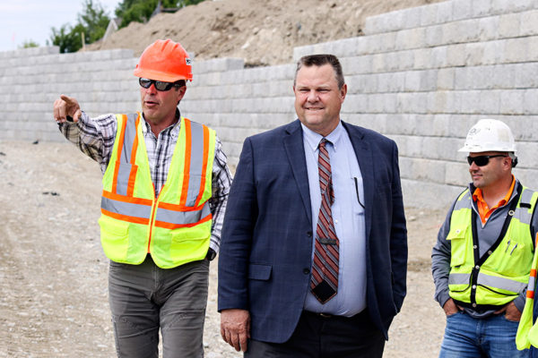 From left: Jim Mitchell, construction manager with the Montana Department (MDT), Sen. Jon Tester, and Jeff Claridge, vice president of LHC, tour the Kalispell Bypass on May 13, 2016. Greg Lindstrom | Flathead Beacon
