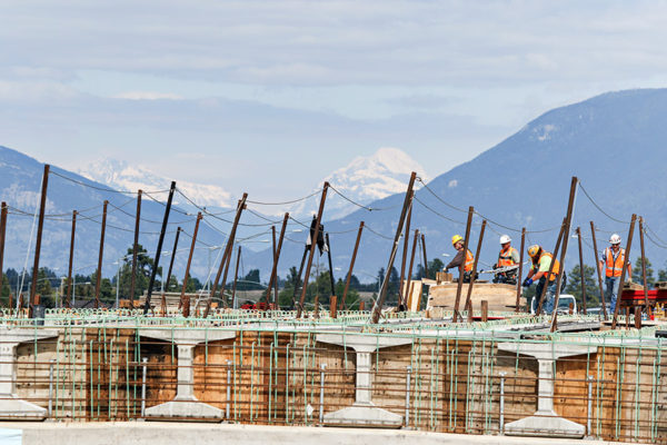 Crews build an overpass near Glacier High School along the Kalispell Bypass. Beacon File Photo
