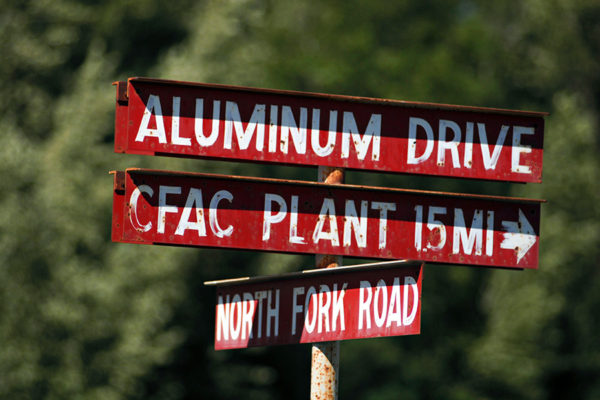 Street signs indicating the Columbia Falls Aluminum Company plant site. Beacon File Photo