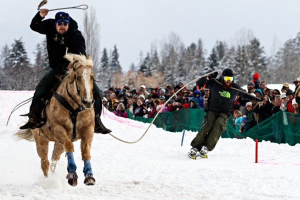 Dane Overland navigates gates while being pulled by Wilson Pike and his horse Yellar at the Whitefish World Invitational Ski Joring event. Beacon File Photo
