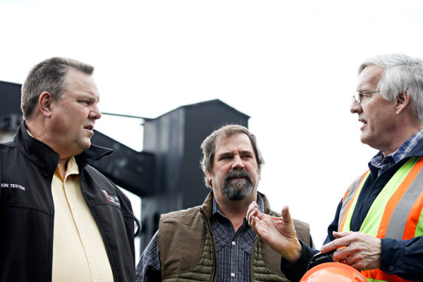 U.S. Sen. Jon Tester, left, tours the Columbia Falls Aluminum Company site with Mike Cirian, center, EPA Remedial Project Manager, and Steve Wright, CFAC environmental manager. Beacon File Photo