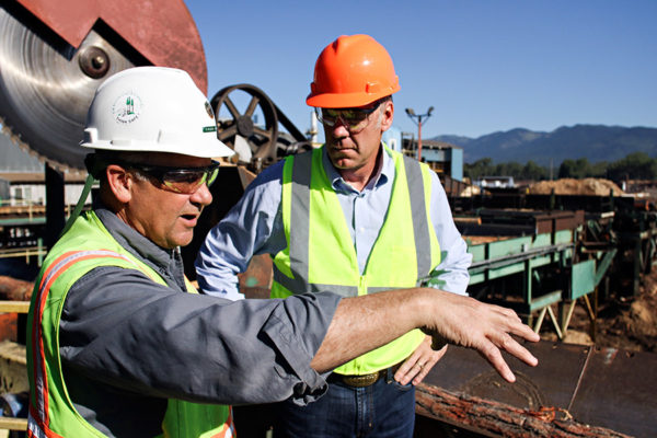 Chuck Roady, director of F.H. Stoltze Land and Lumber Co., explains toperations to U.S. Rep. Ryan Zinke during a tour of the Columbia Falls facility on July 21, 2016. Greg Lindstrom | Flathead Beacon