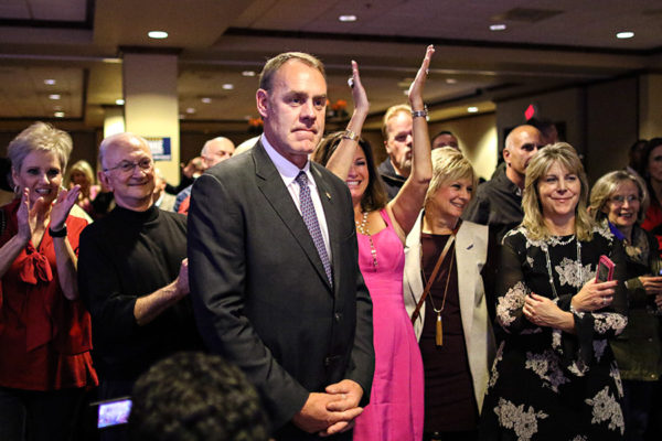 Supporters cheer as U.S. Rep. Ryan Zinke watches election returns at The Lodge at Whitefish Lake on Nov. 8, 2016. Greg Lindstrom | Flathead Beacon