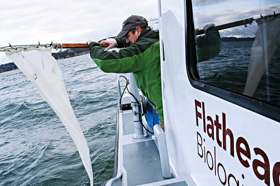 Phil Matson, research specialist with the Flathead Lake Biological Station, collects an eDNA sample along the north shore of Flathead Lake on Dec. 2, 2016. Greg Lindstrom | Flathead Beacon