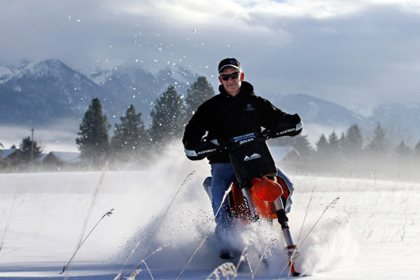 Todd Trent rides through a field of powder at Old Faithful Motorsports in Bigfork on Dec. 30, 2016. Greg Lindstrom | Flathead Beacon