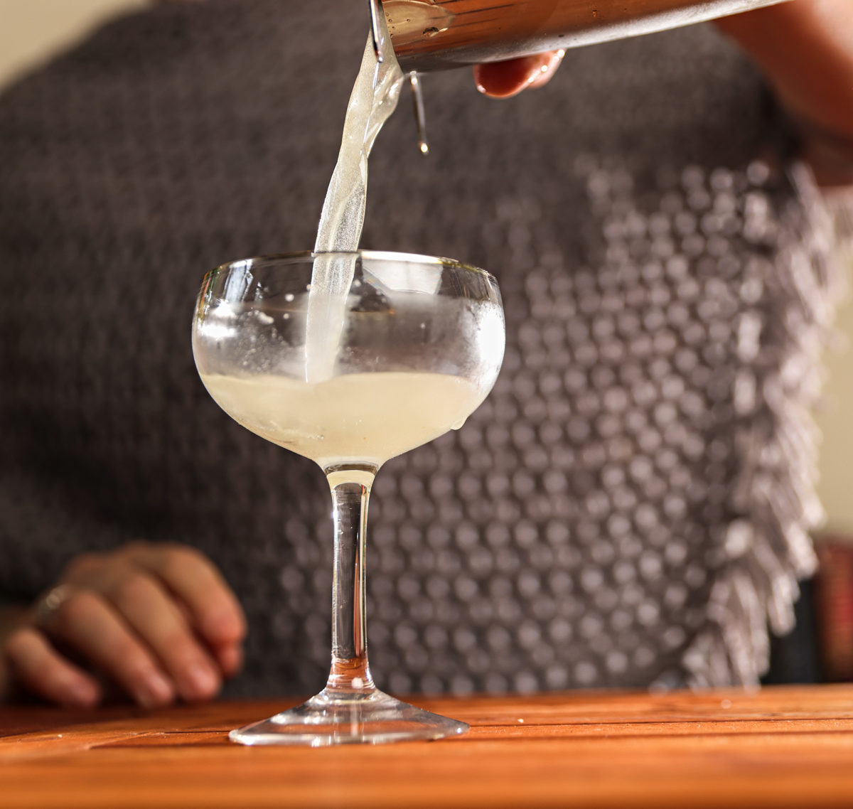 A cocktail being poured  by Meaghan Schmoll of Raskol Drink