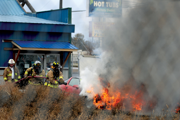 Evergreen Firefighters Extinguish Flaming Car